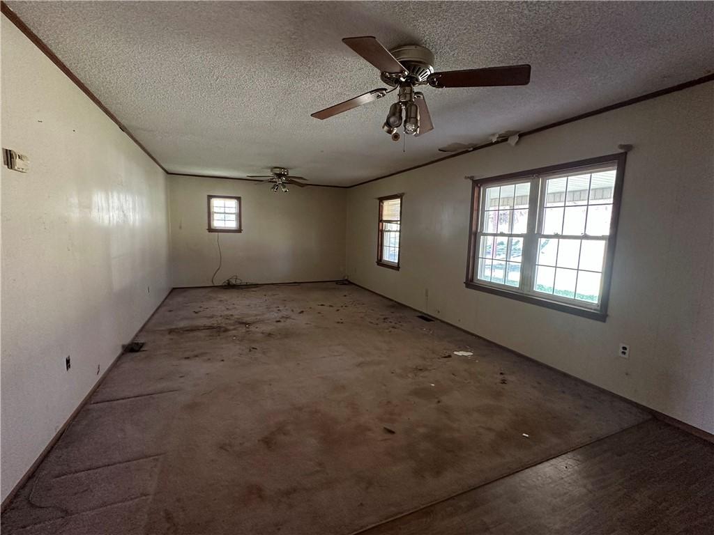 Image 4: This spacious living area offers a blank canvas fo