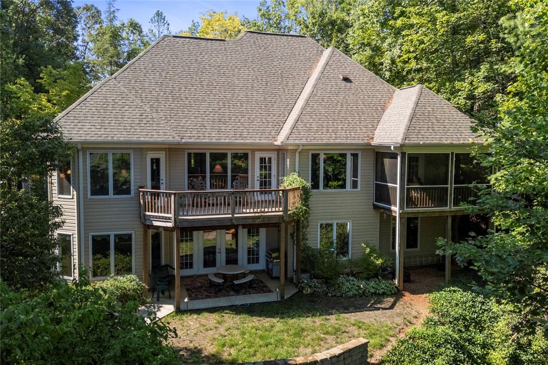 Image 3: This house features multiple decks and patios, per