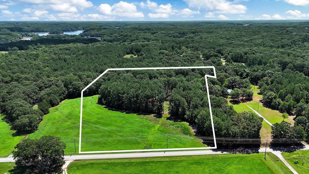 Image 4: A vast expanse of undeveloped land bordered by mat