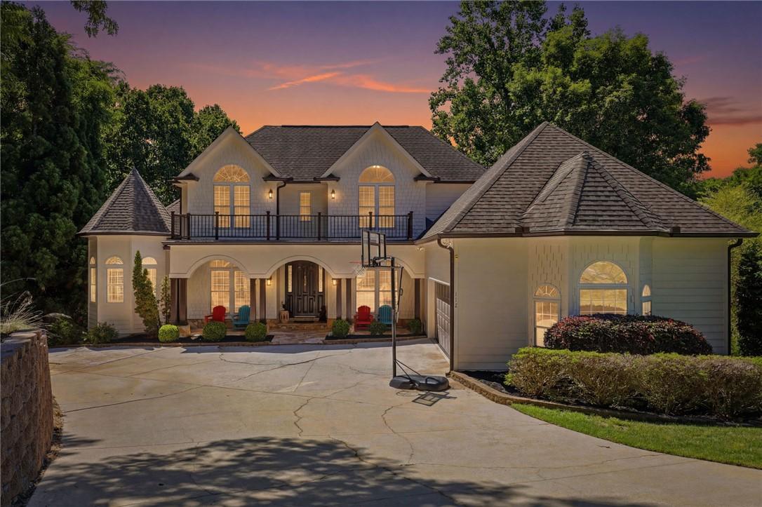 Image 1: This grand residence showcases a charming facade a