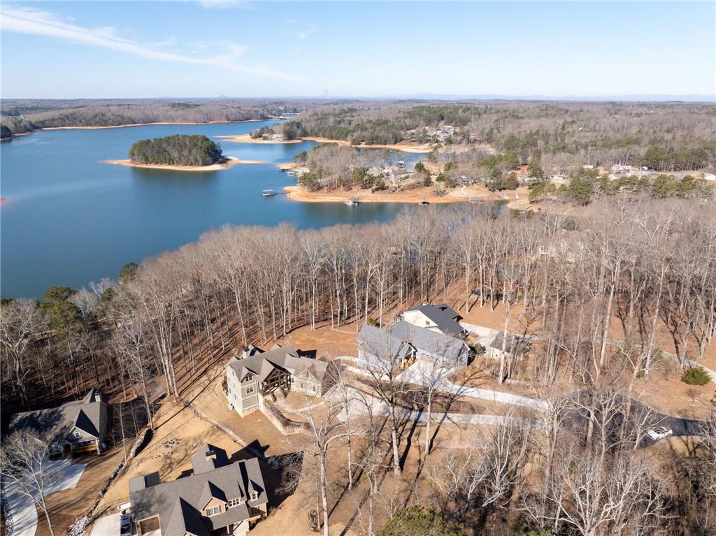 Image 4: Perched above a serene lake, this residence offers