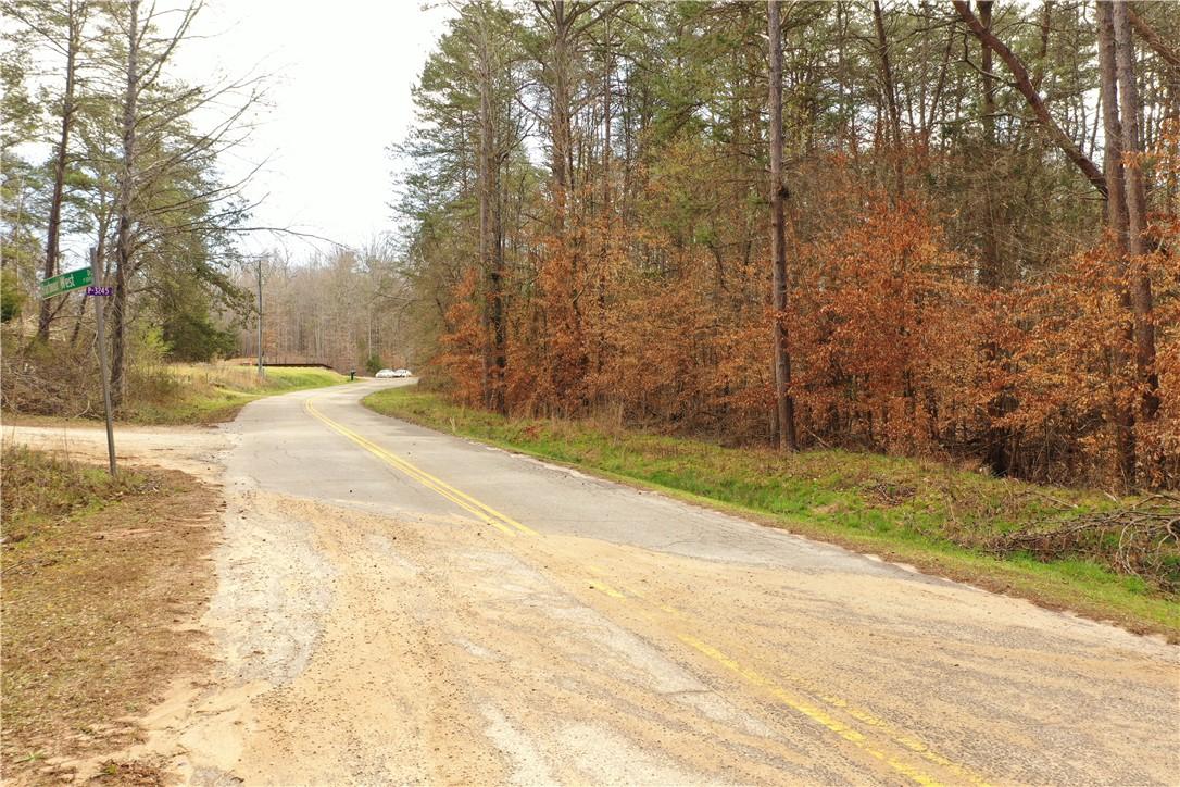 Image 2: A tranquil wooded lot awaits, offering privacy and