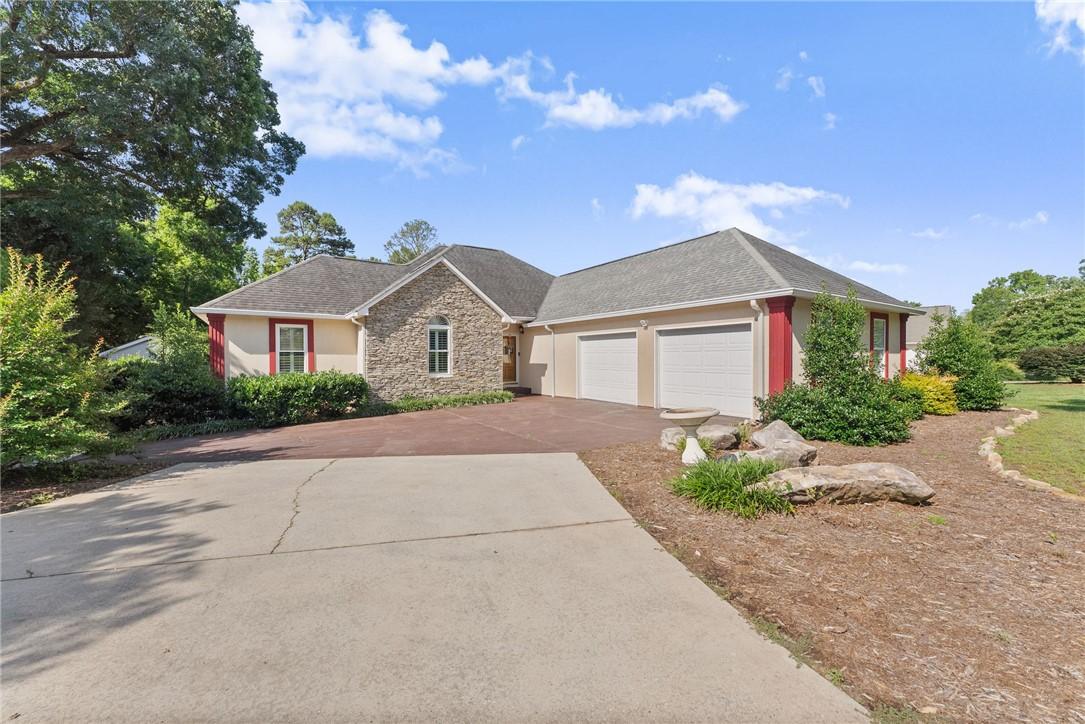 Image 4: A well-maintained residence features a stone and s