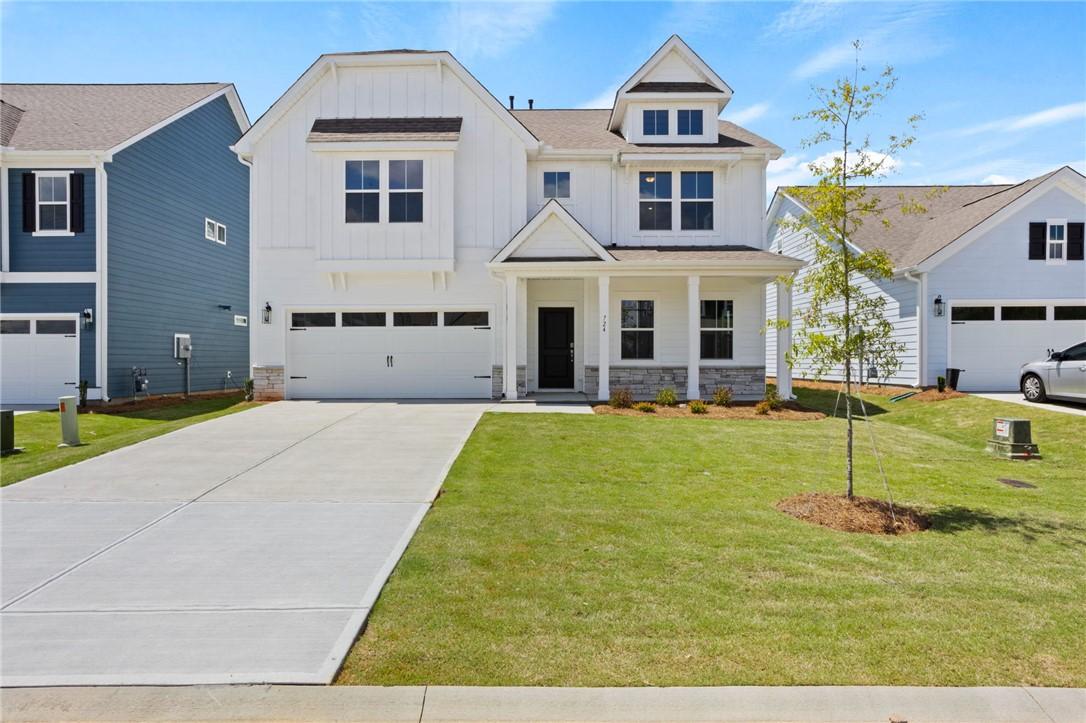 Image 1: A well-maintained lawn welcomes you to this modern