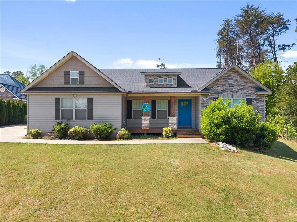 Image 3: This charming home offers curb appeal with classic