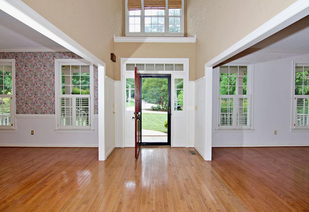 Image 4: A grand entrance with double-height ceilings and a