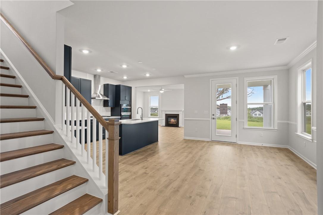 Image 3: An open concept design seamlessly blends the kitch