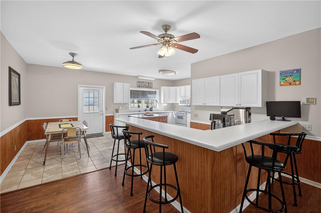 Image 4: This spacious kitchen offers a functional layout,