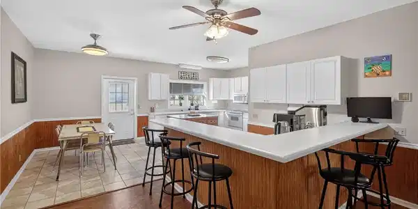 Image 4: This spacious kitchen offers a functional layout,