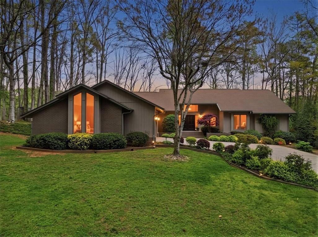 Image 1: This captivating residence presents a distinguishe