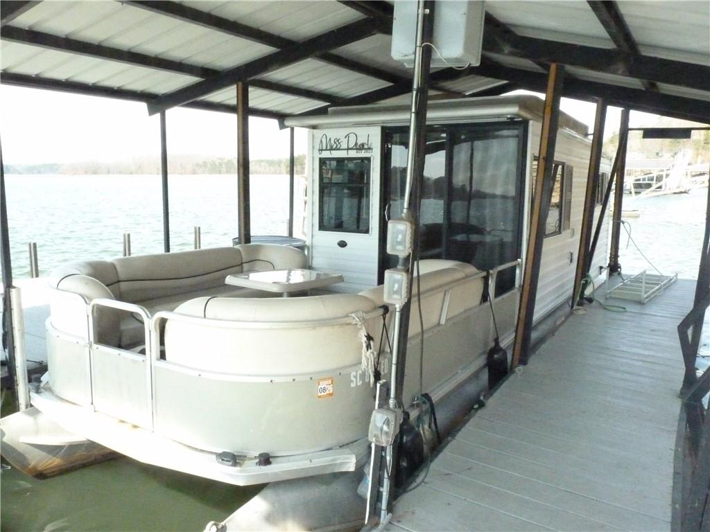Image 3: This tranquil waterfront setting includes a covere