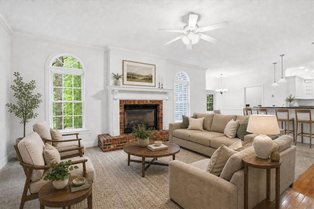Image 2: A comforting living area with a classic brick fire