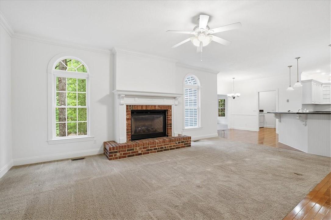 Image 3: A comforting fireplace provides warmth in this ope