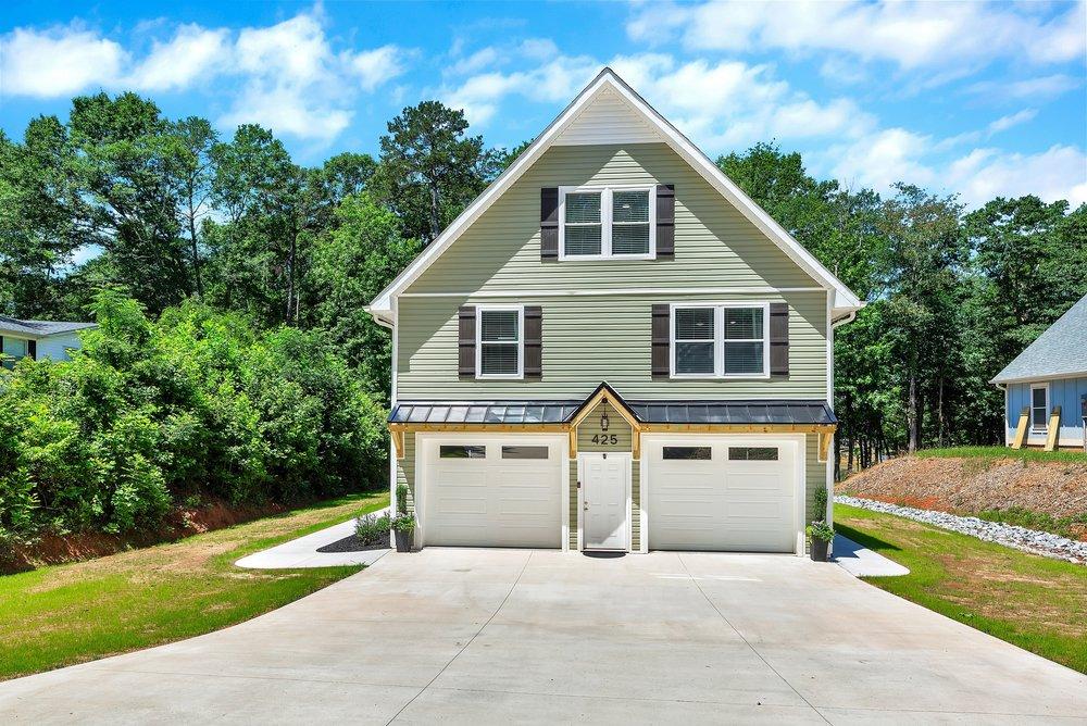 Image 2: A newly constructed residence features an attached