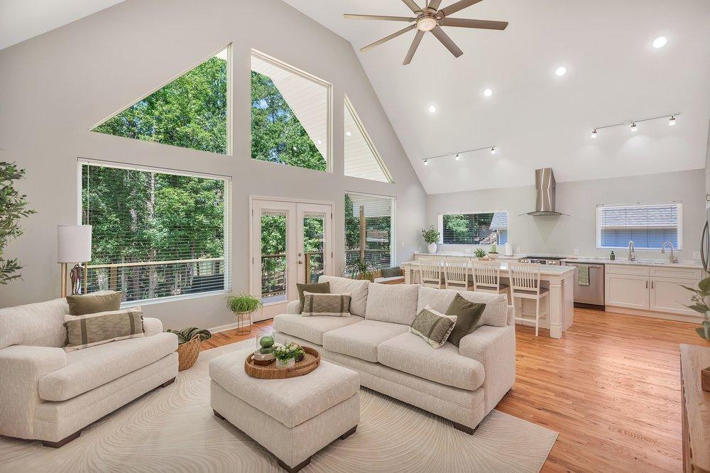 Image 3: The open-concept living space integrates a stylish
