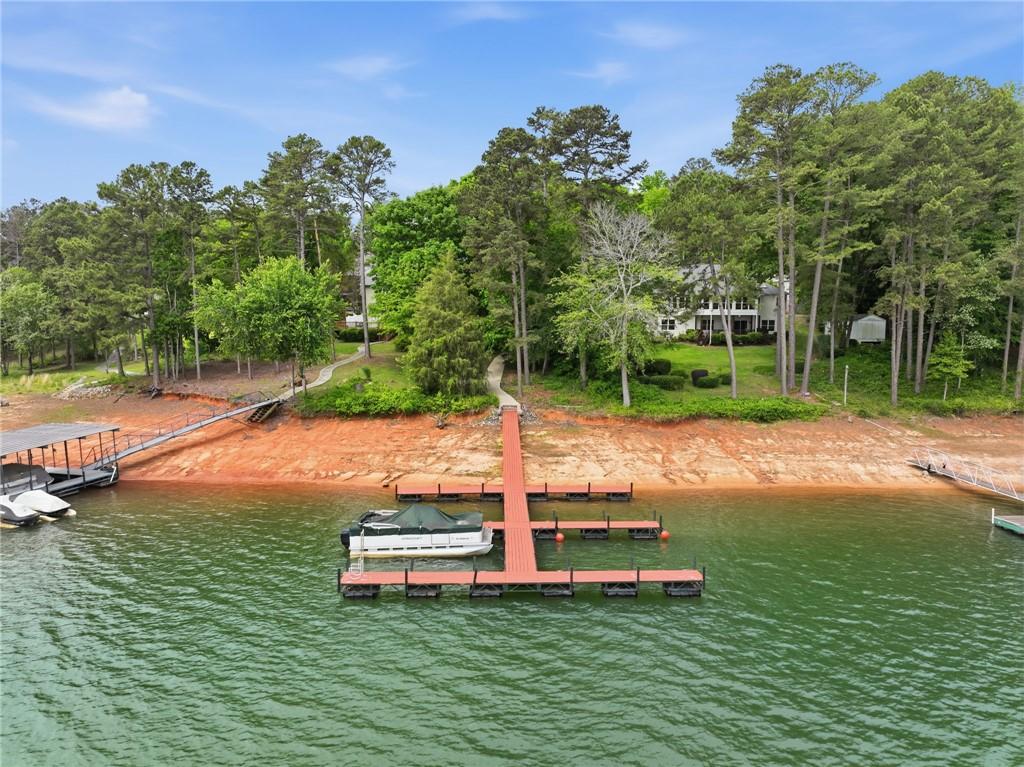 Image 3: This serene lakeside property boasts a private doc
