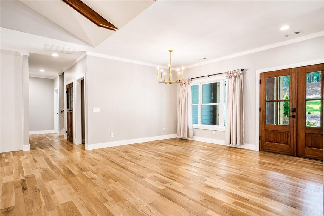 Image 3: Natural light floods this inviting living space, h