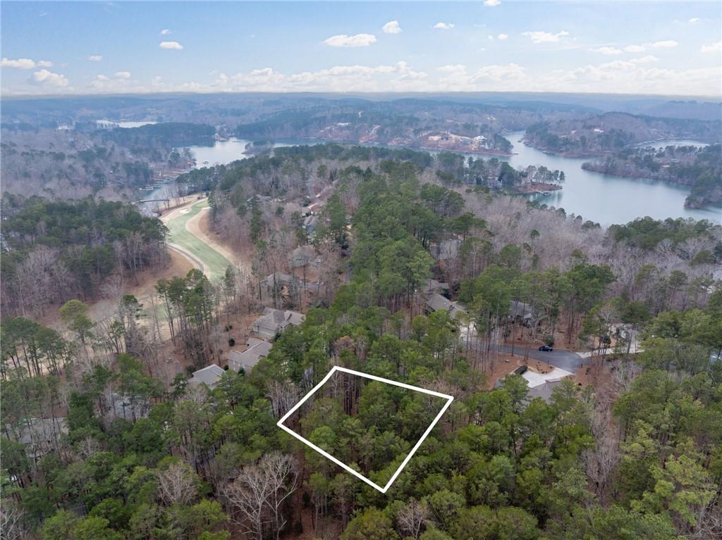 Image 1: This aerial view showcases a desirable lot with la