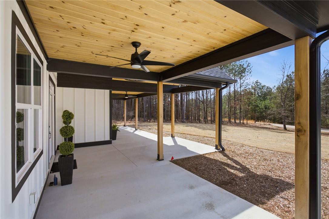 Image 4: This spacious covered patio offers ample outdoor l