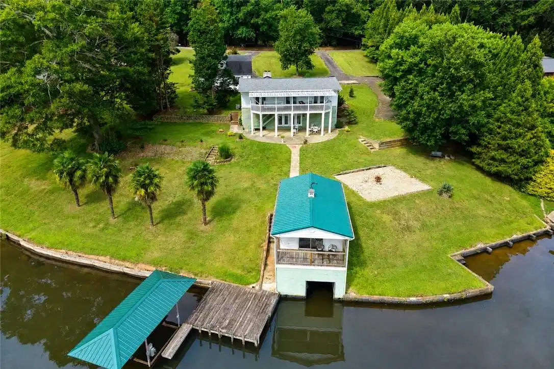 Image 1: Lakeside living beckons with a multi-level home, b