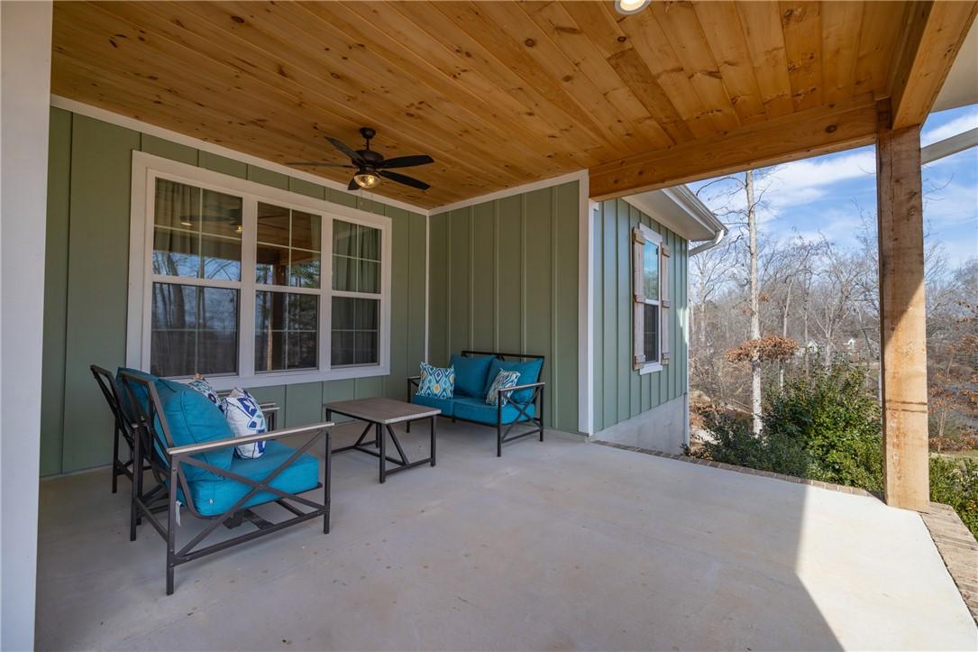 Image 4: Relax on this inviting patio, offering a serene ou