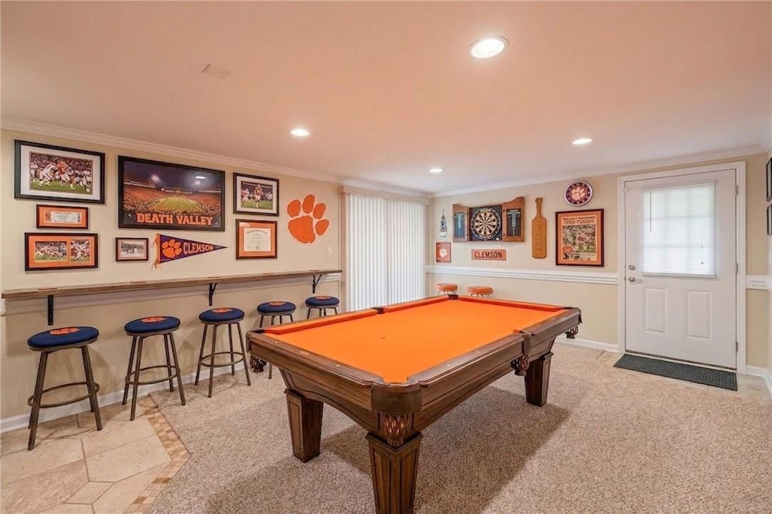 Image 2: A vibrant recreation room with ample space for ent