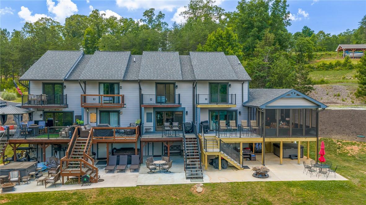 Image 2: Multi-level decks and patios extend outdoor living