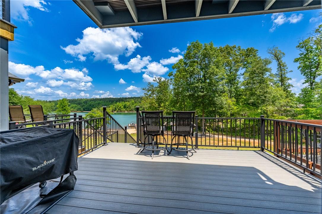 Image 4: Enjoy tranquil lake views from this elevated deck,