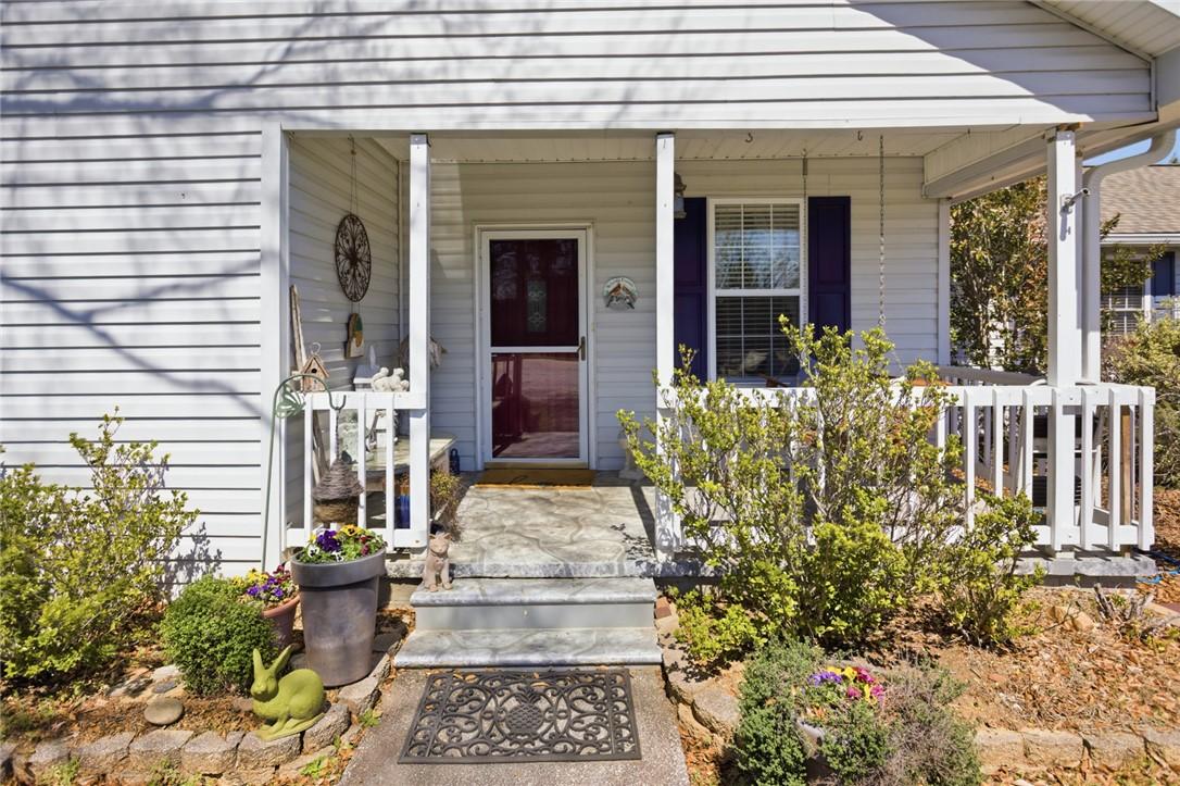 Image 3: This charming front porch welcomes you with classi