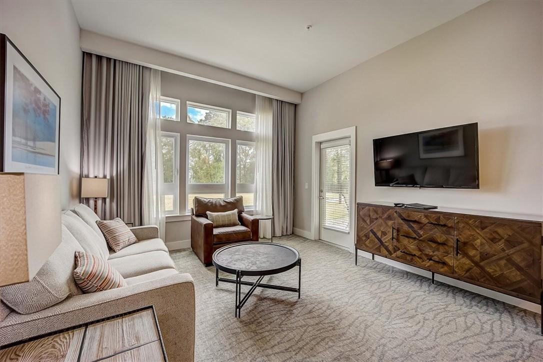 Image 3: This living area features a bright, airy ambiance