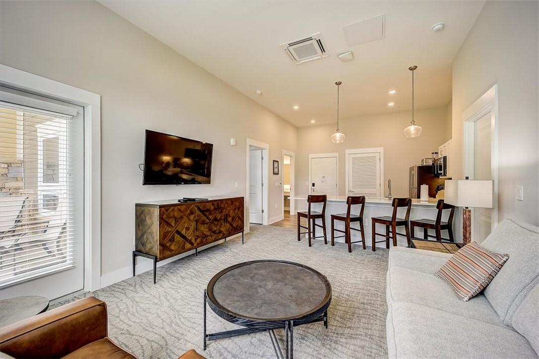 Image 4: This living room seamlessly blends comfort with a