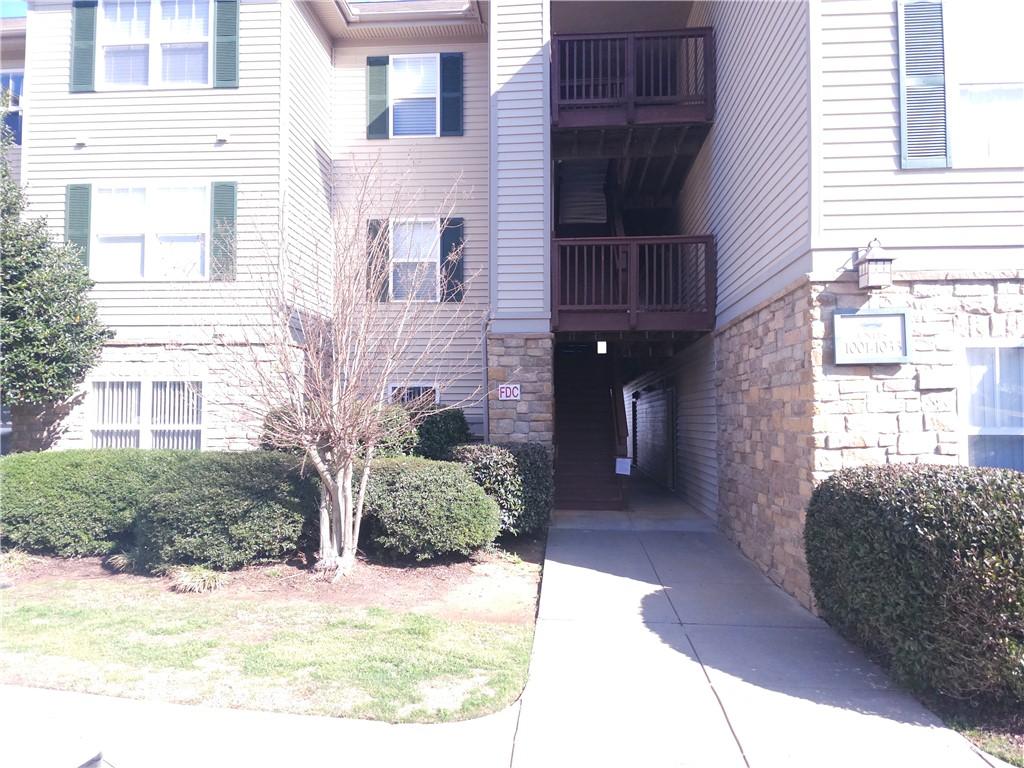 Image 2: This multi-story dwelling features charming balcon