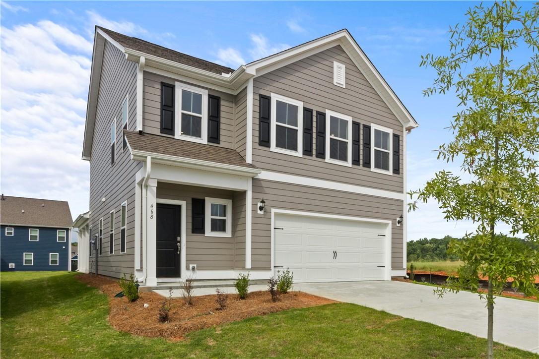 Image 2: Modern two-story residence with a classic gray fac