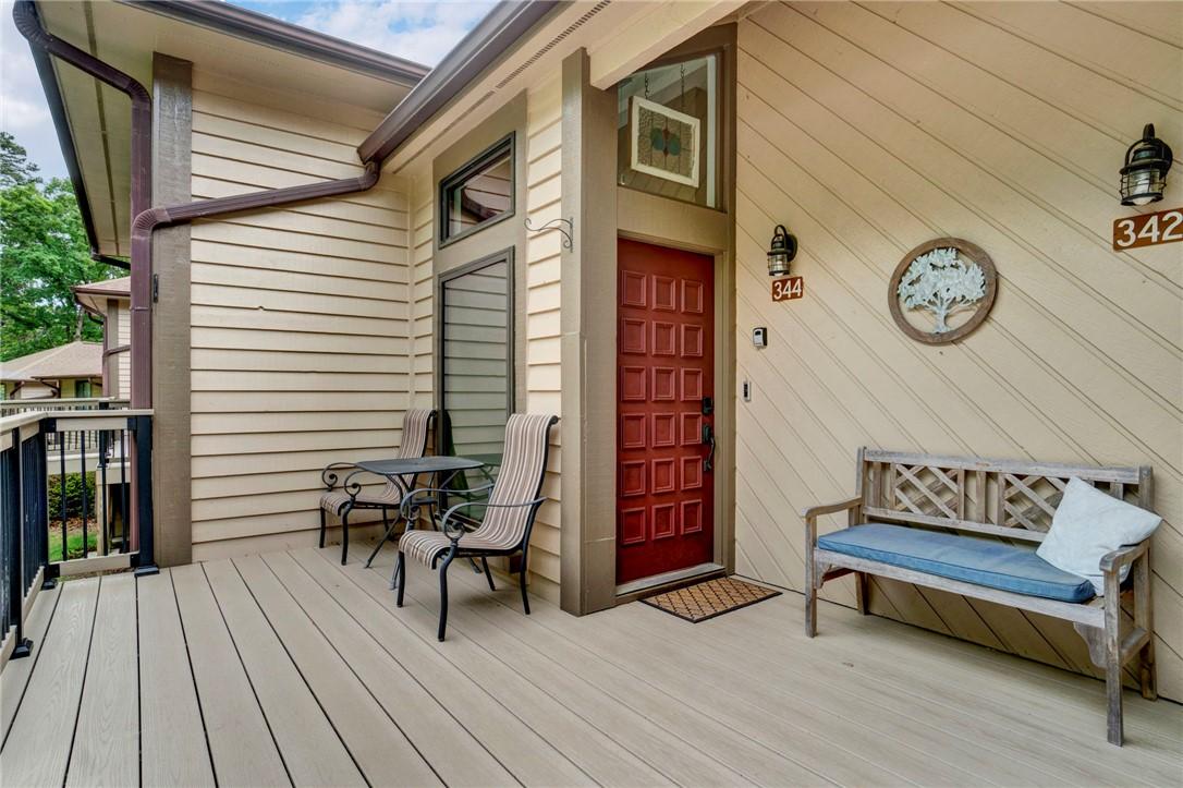 Image 4: This inviting outdoor space features a private por