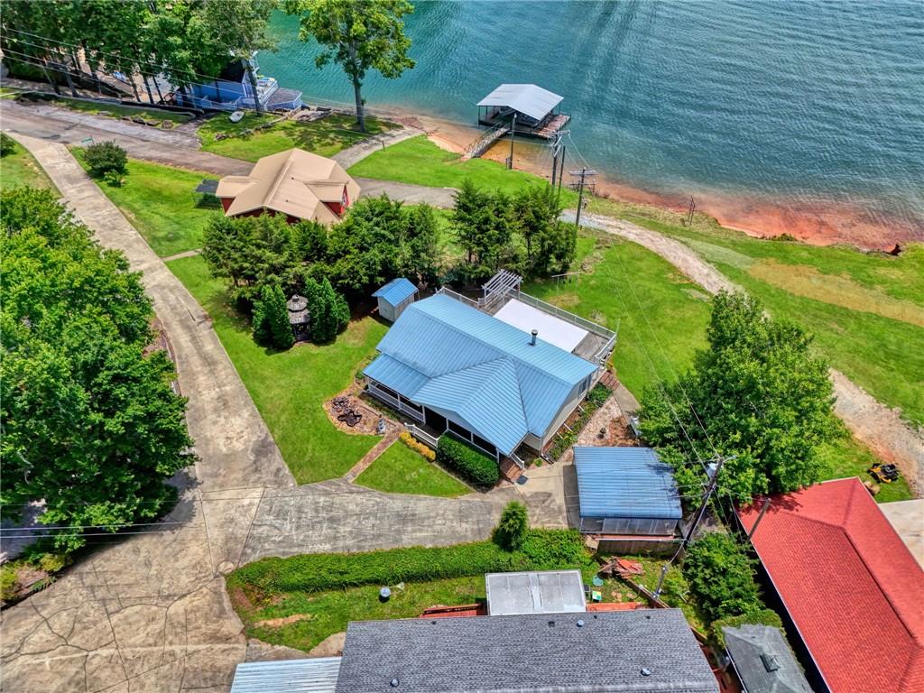 Image 3: An aerial perspective reveals a serene lakefront p