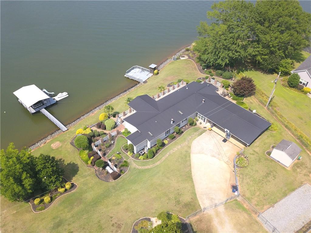 Image 4: An aerial perspective showcases a waterfront home