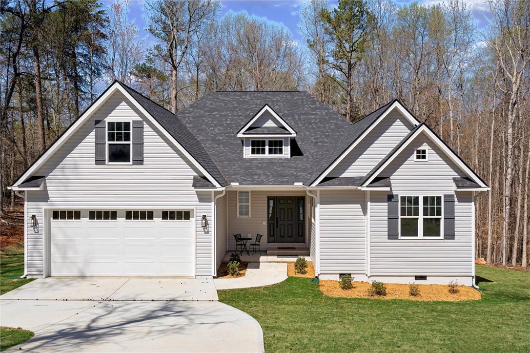 Image 1: This charming residence features a well-maintained