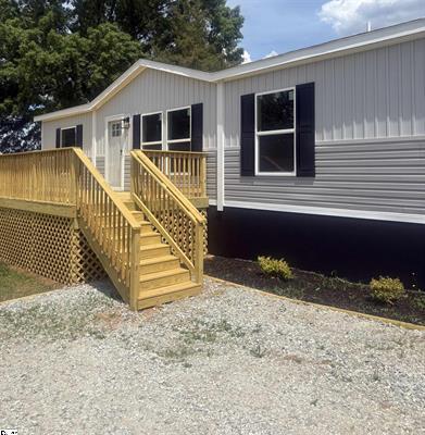 Image 2: A newly constructed, single-story home with a fres