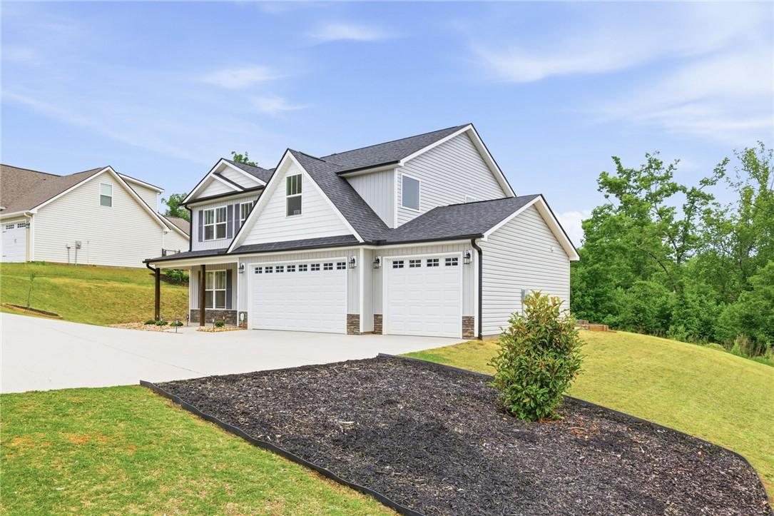 Image 3: This newly constructed home features a clean facad