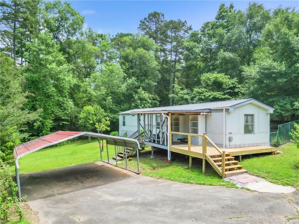 Image 1: A welcoming front deck provides access to this cha