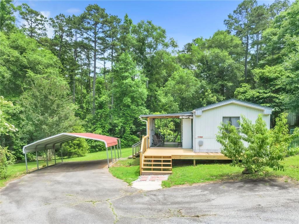 Image 4: A quaint residence nestled amidst lush trees, feat