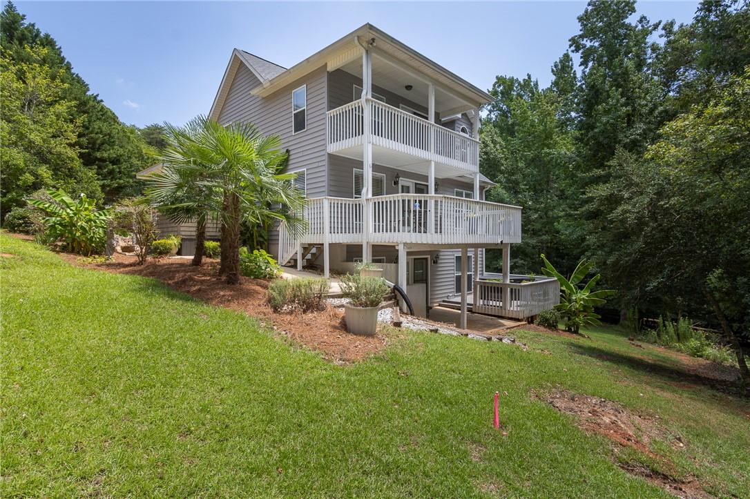 Image 2: Multi-level outdoor decks and balconies extend liv