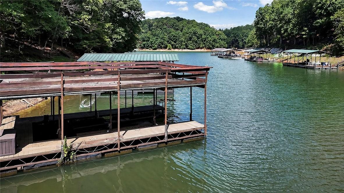 Image 4: Boathouses line the waterfront, offering direct la