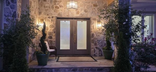 Image 3: This inviting entrance features natural stone and