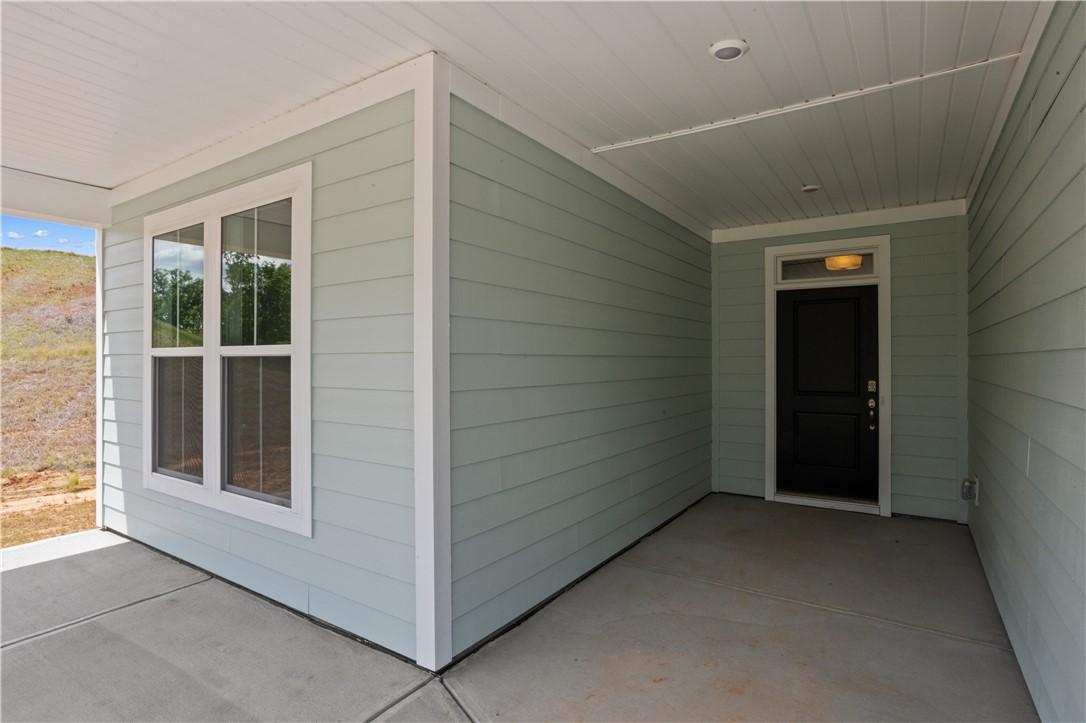 Image 3: An inviting front entry with a covered porch offer