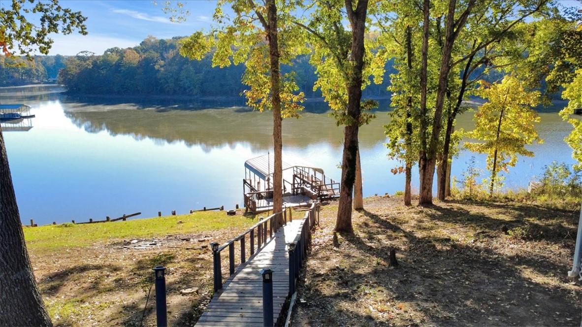 Image 3: This serene lakefront property offers private wate