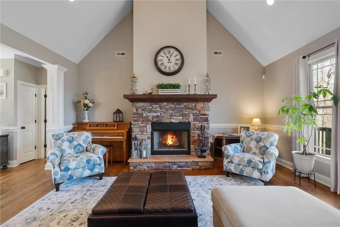 Image 4: This inviting living area features vaulted ceiling