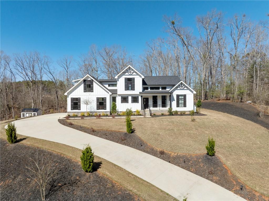 Image 2: This newly constructed home features a modern farm