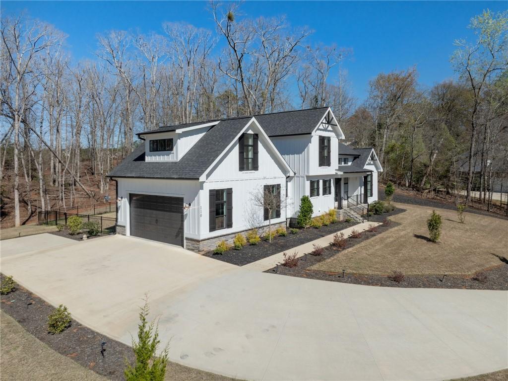 Image 3: This newly constructed home boasts a modern farmho
