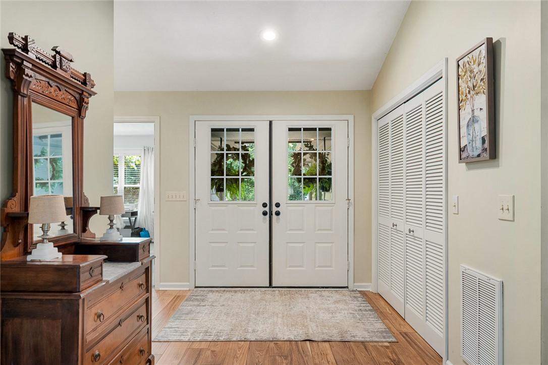 Image 4: Step inside to a welcoming entry, showcasing rich